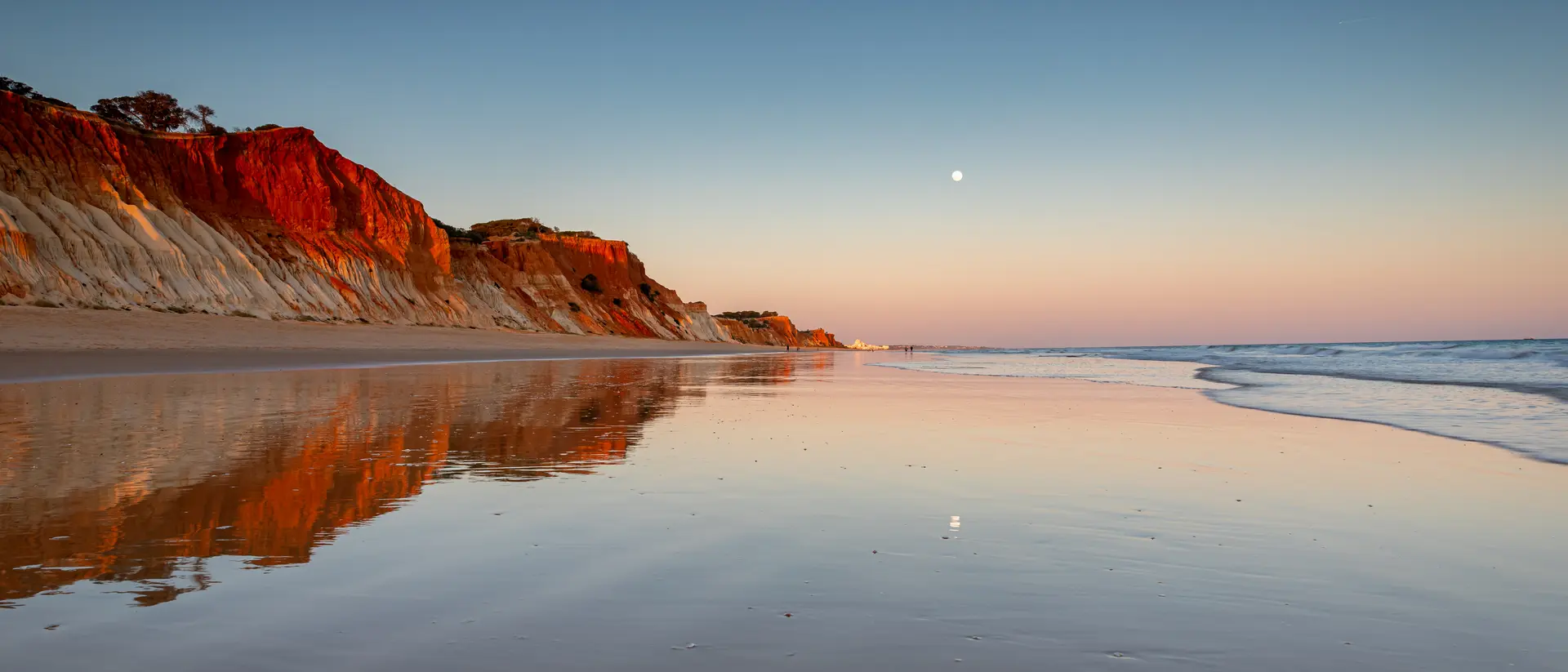 Wander the reflective shores of Albufeira