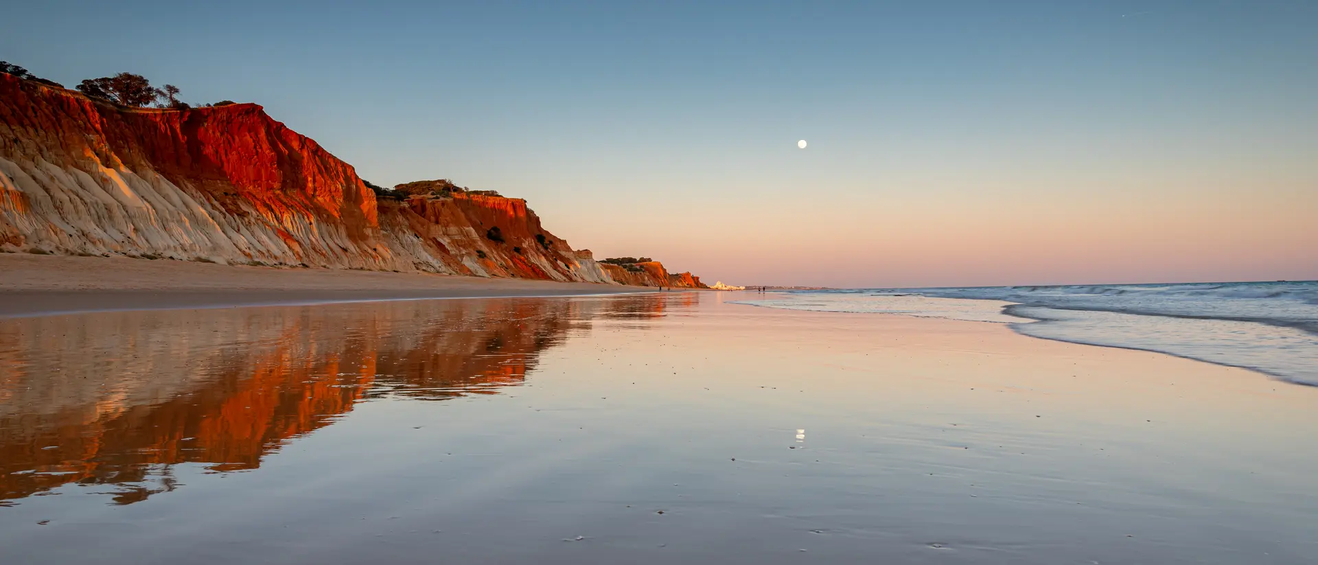 Wander the reflective shores of Albufeira