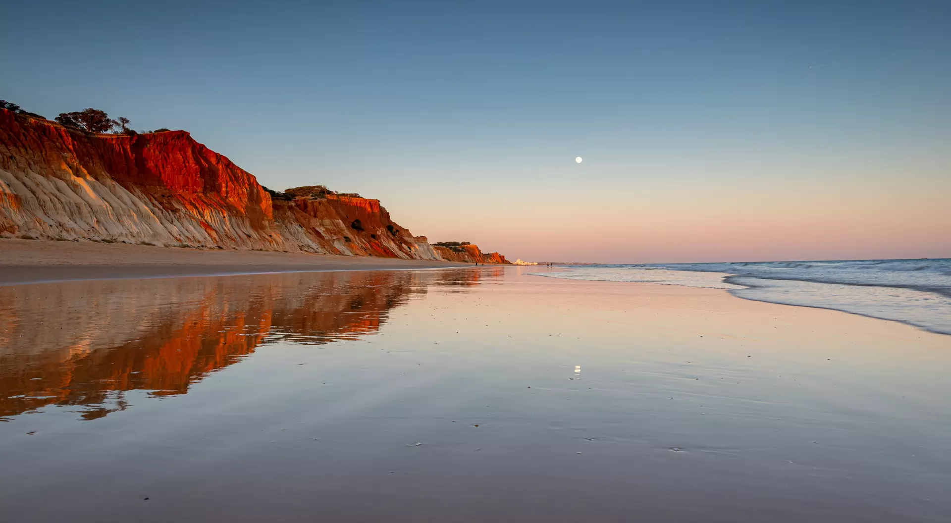Wander the reflective shores of Albufeira