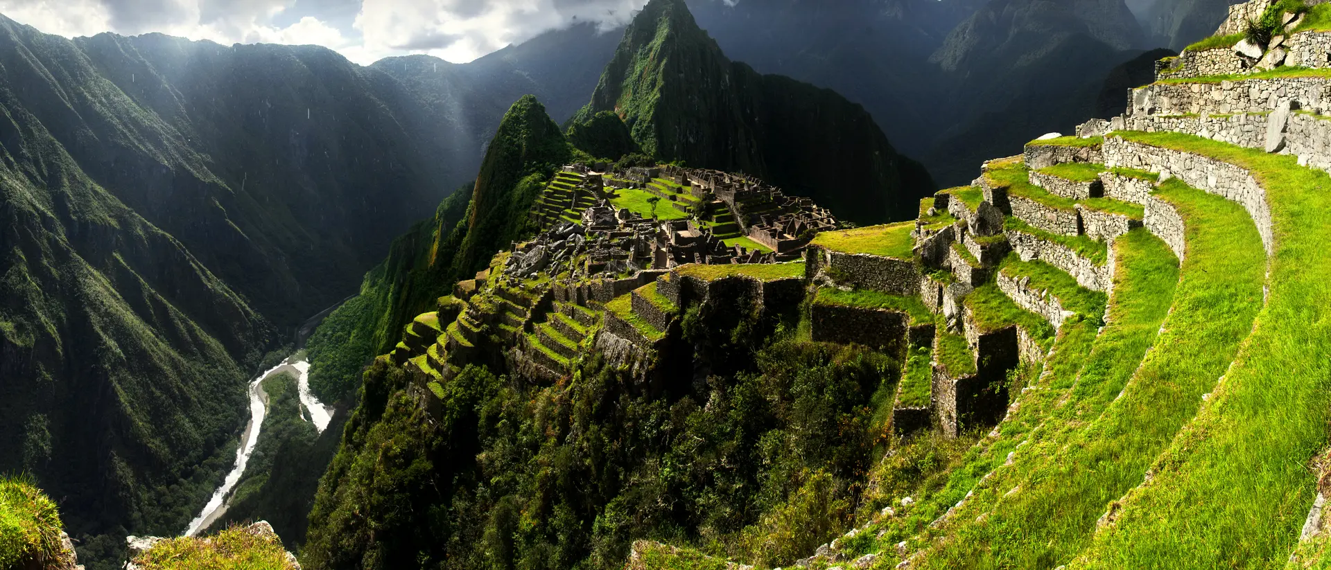 Breathtaking view of Machu Picchu cascading into lush valleys