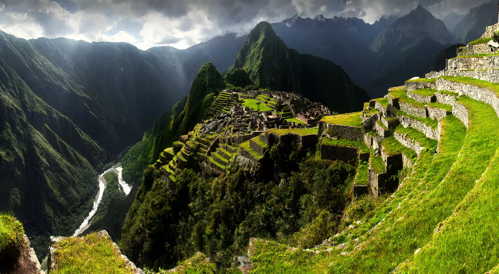 Breathtaking view of Machu Picchu cascading into lush valleys