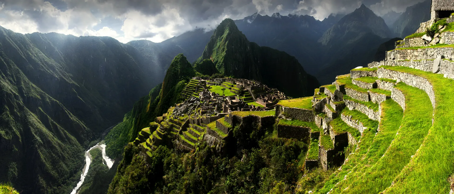 Breathtaking view of Machu Picchu cascading into lush valleys