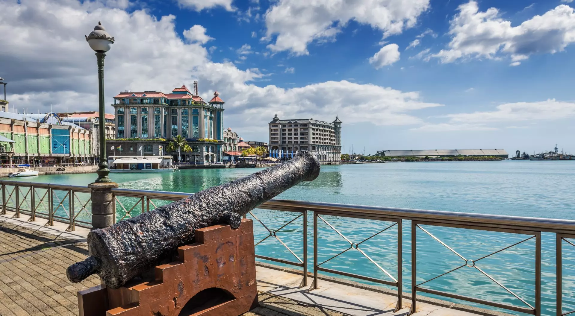 Old cannon on the promenade at Caudan Waterfront, Port Louis, Mauritius.