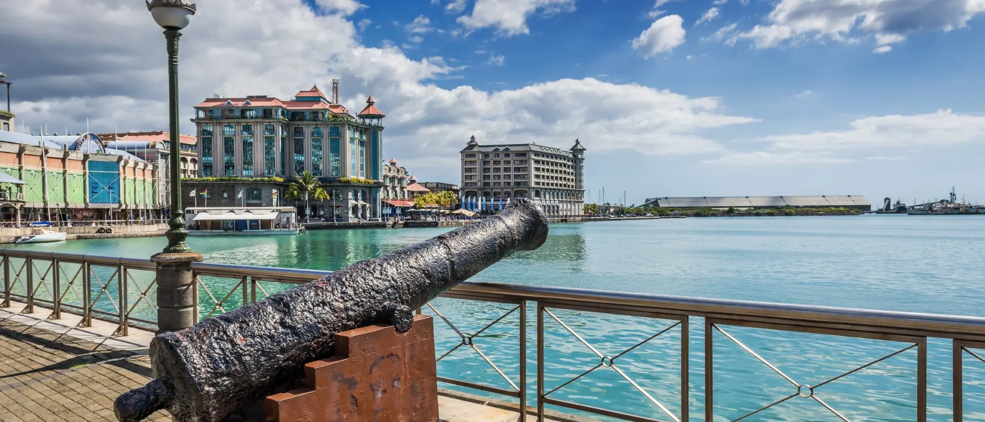 Old cannon on the promenade at Caudan Waterfront, Port Louis, Mauritius.