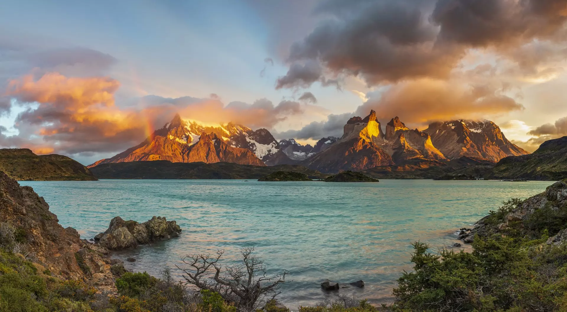 Sunrise with Rainbow in the Patagonian Andes Mountains