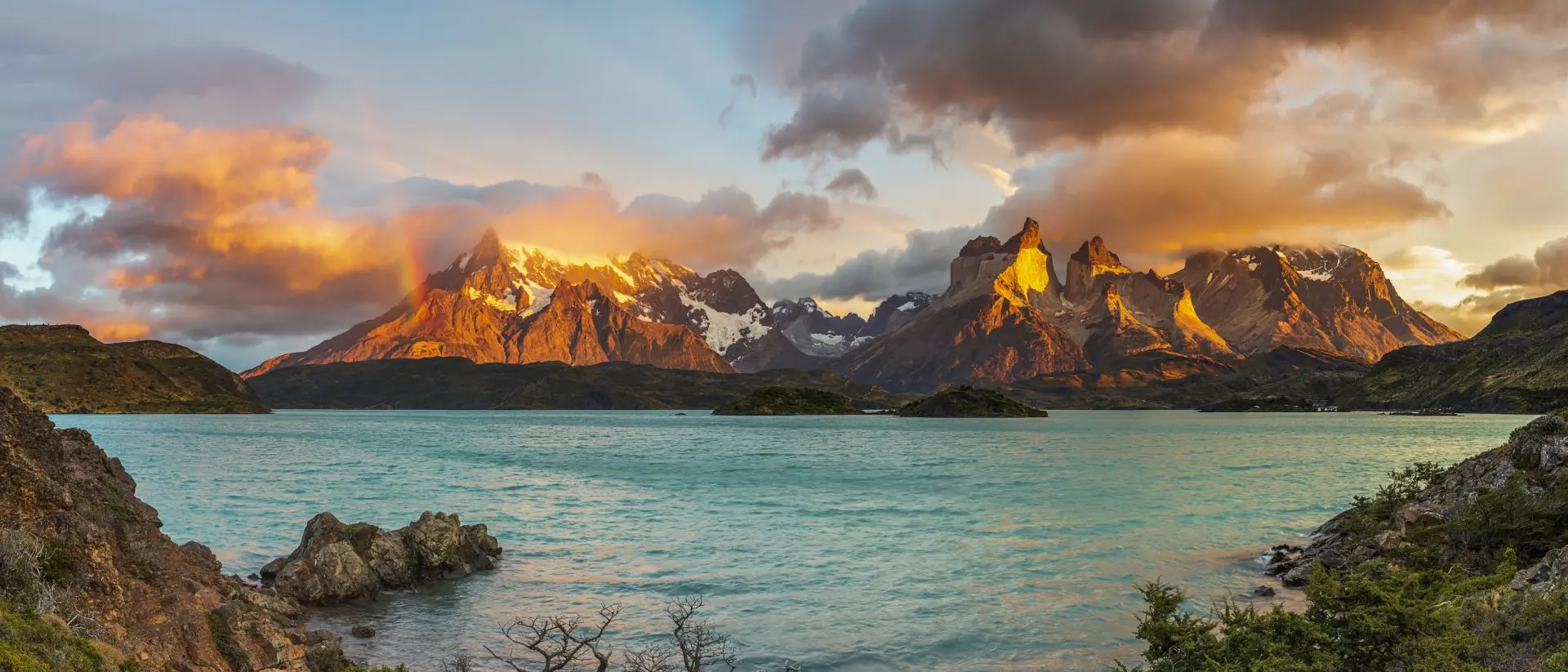 Sunrise with Rainbow in the Patagonian Andes Mountains