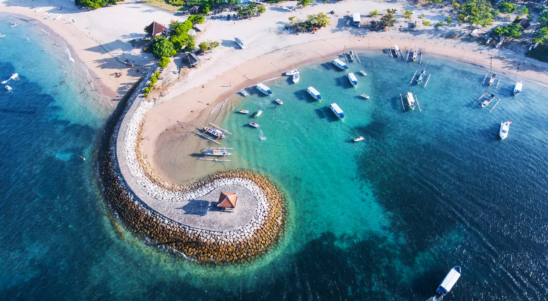 Bali Nusa Dua coast with a figurative breakwater aerial view.
