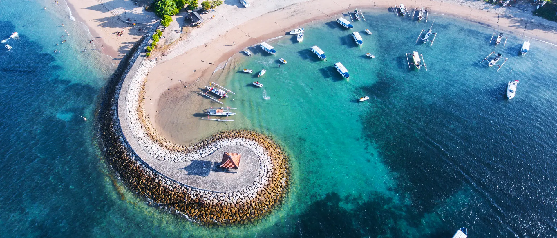 Bali Nusa Dua coast with a figurative breakwater aerial view.