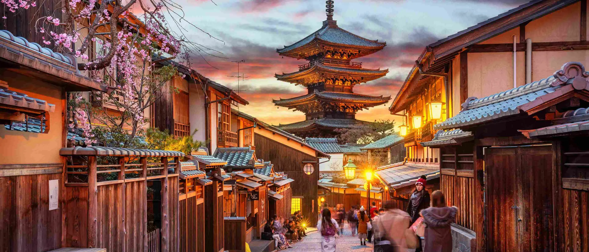 Yasaka Pagoda and Sannen Zaka Street, Kyoto, Japan. Tourists wander down the narrow streets of the Higashiyama District neighbourhood in Kyoto, Japan