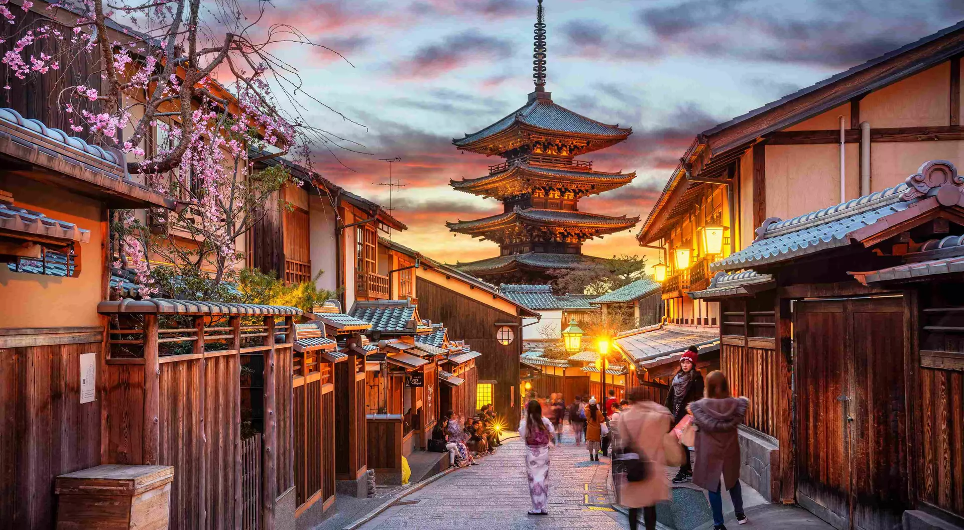 Yasaka Pagoda and Sannen Zaka Street, Kyoto, Japan. Tourists wander down the narrow streets of the Higashiyama District neighbourhood in Kyoto, Japan