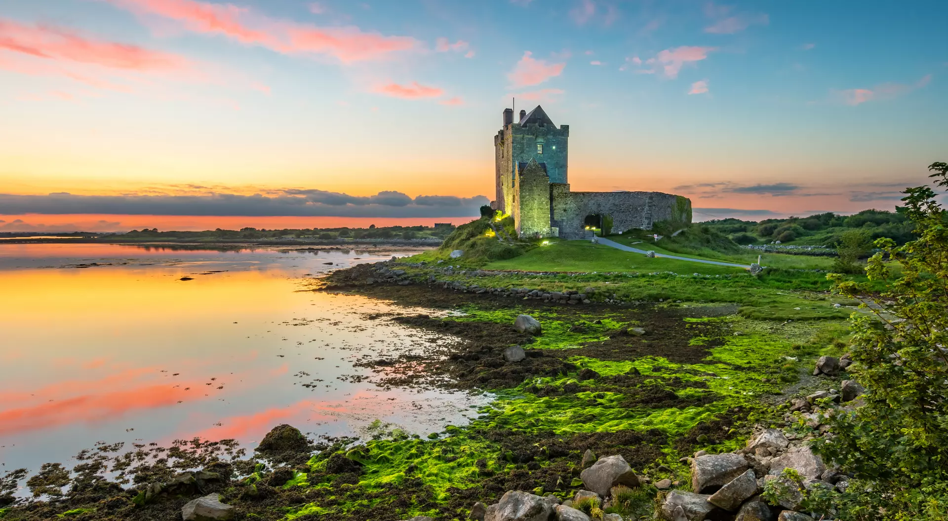 Dunguaire Castle on the shores of Galway Bay Ireland during a beautiful sunset