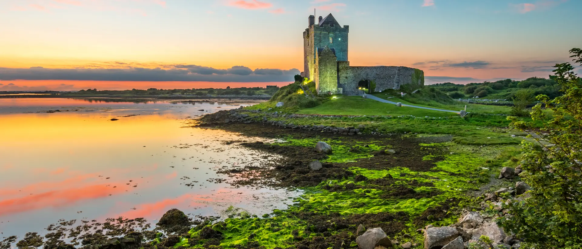 Dunguaire Castle on the shores of Galway Bay Ireland during a beautiful sunset