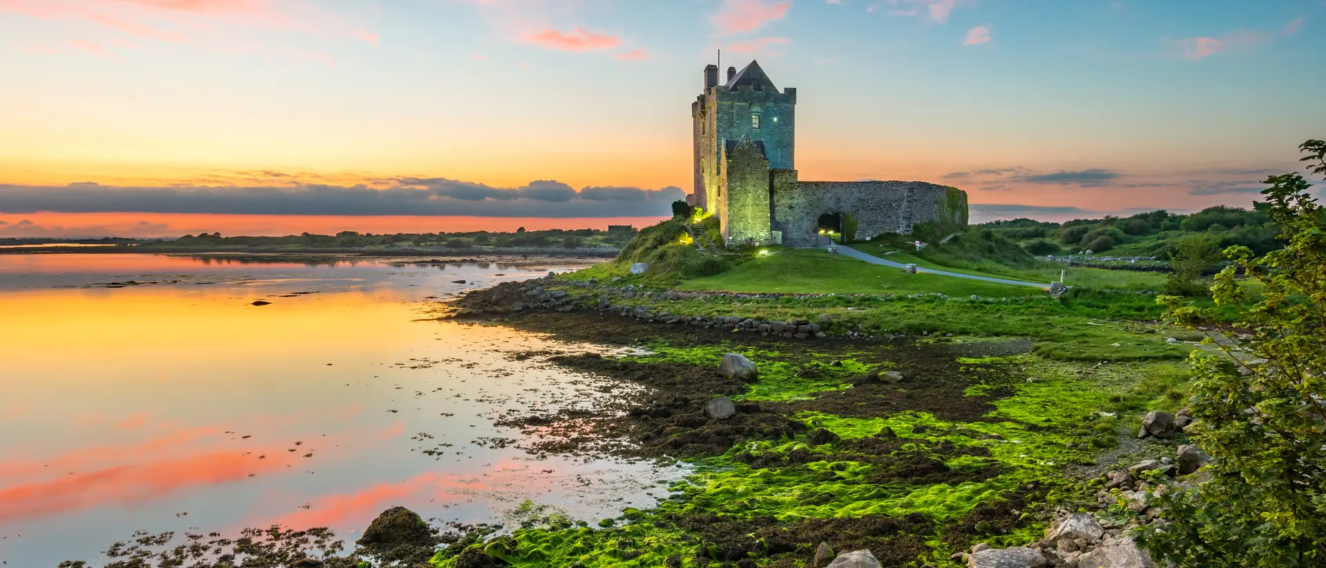 Dunguaire Castle on the shores of Galway Bay Ireland during a beautiful sunset