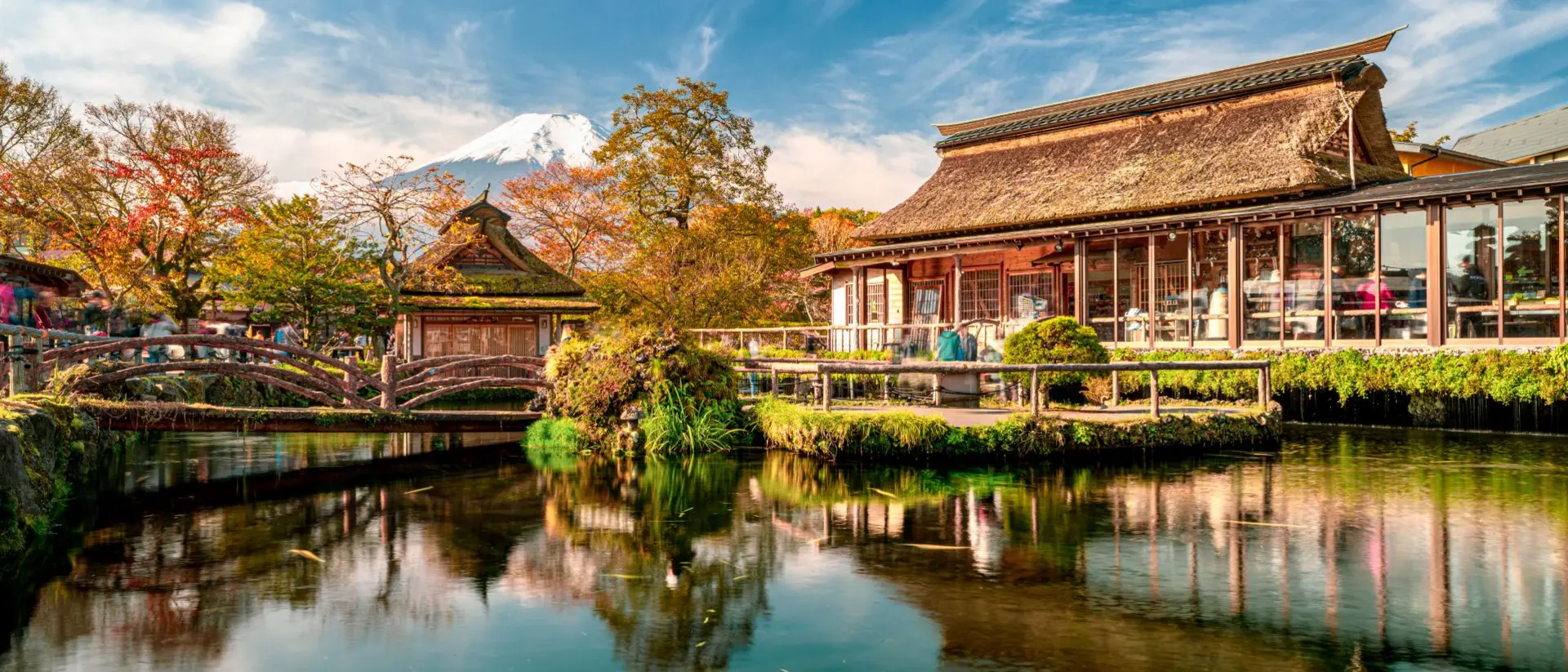Beautiful Fuji mountain and pond reflection with Traditional Japanese style house at Oshino Hakkai in Japan.