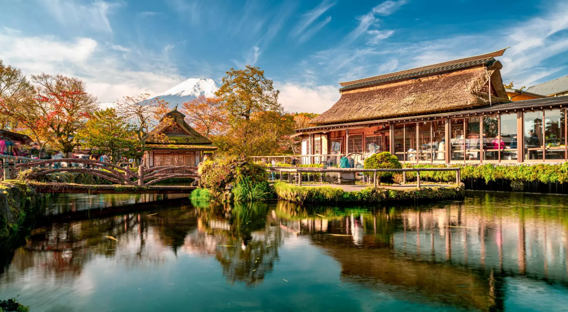 Beautiful Fuji mountain and pond reflection with Traditional Japanese style house at Oshino Hakkai in Japan.