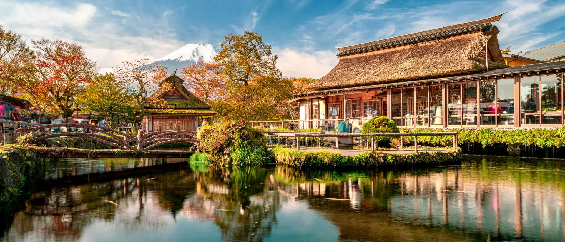 Beautiful Fuji mountain and pond reflection with Traditional Japanese style house at Oshino Hakkai in Japan.