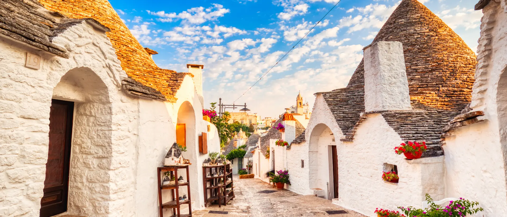 Famous Trulli Houses during a Sunny Day with Bright Blue Sky in Alberobello, Puglia, Italy