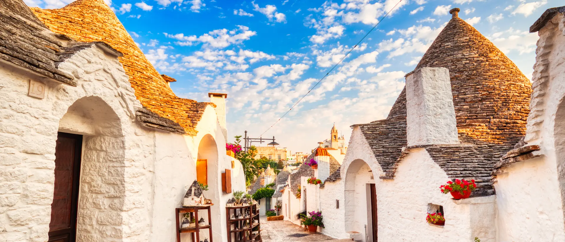 Famous Trulli Houses during a Sunny Day with Bright Blue Sky in Alberobello, Puglia, Italy
