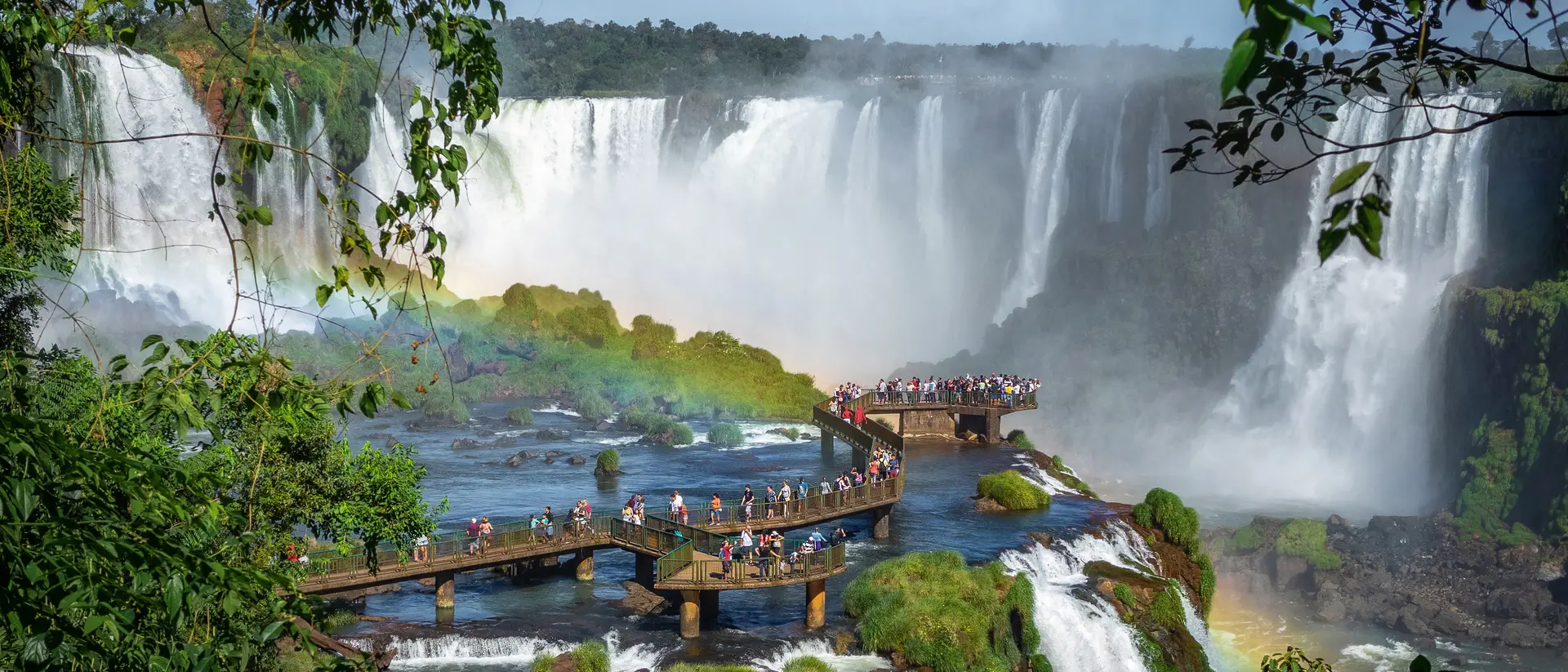 Tourists Exploring Iguazu Falls on the boardwalk of the Brazil side.