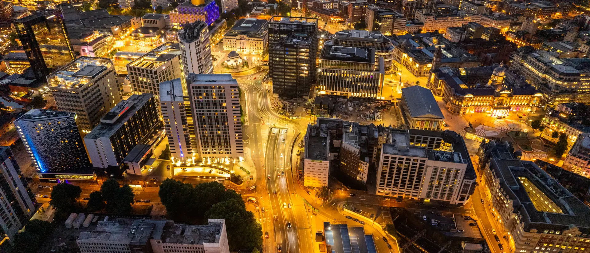 Birmingham United Kingdom Aerial view over the city center by night