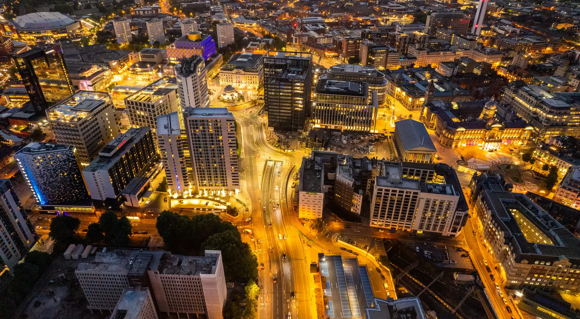 Birmingham United Kingdom Aerial view over the city center by night