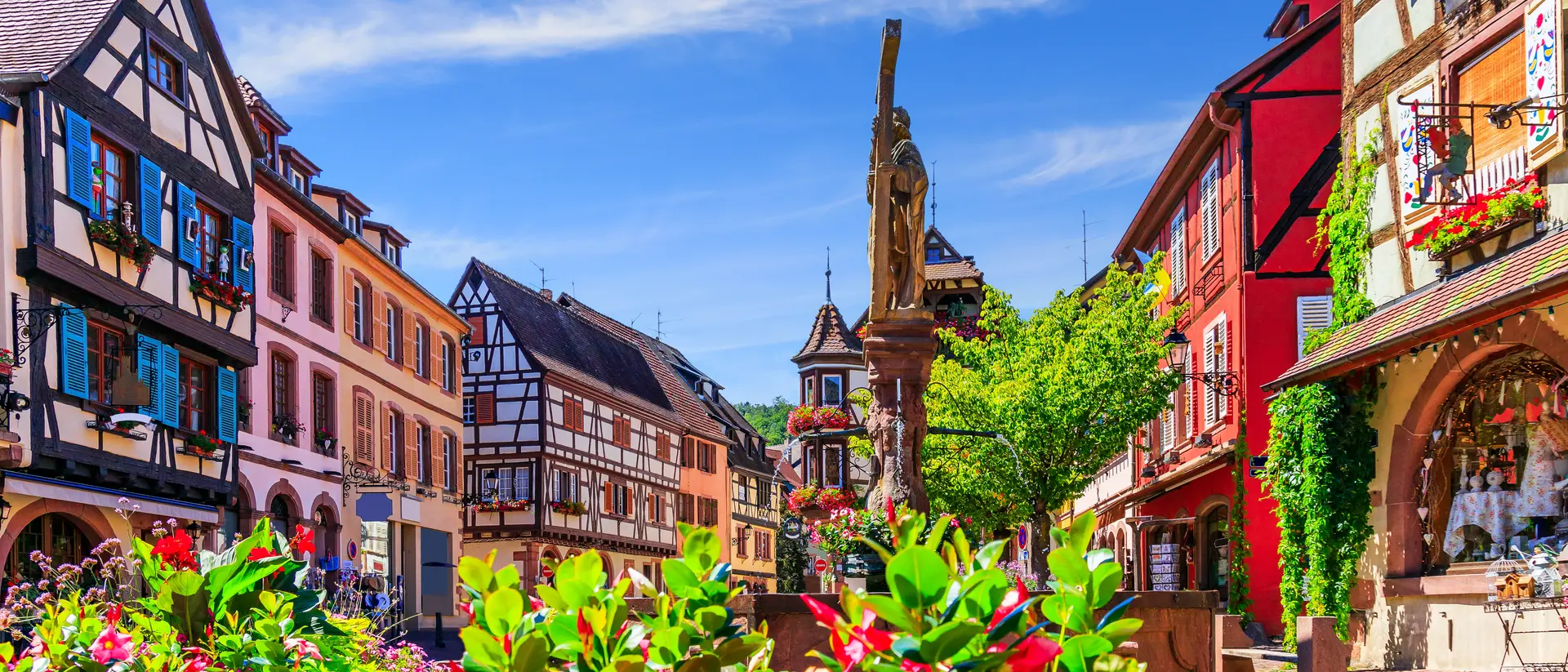 Picturesque street with traditional half timbered houses on the Alsace Wine Route.