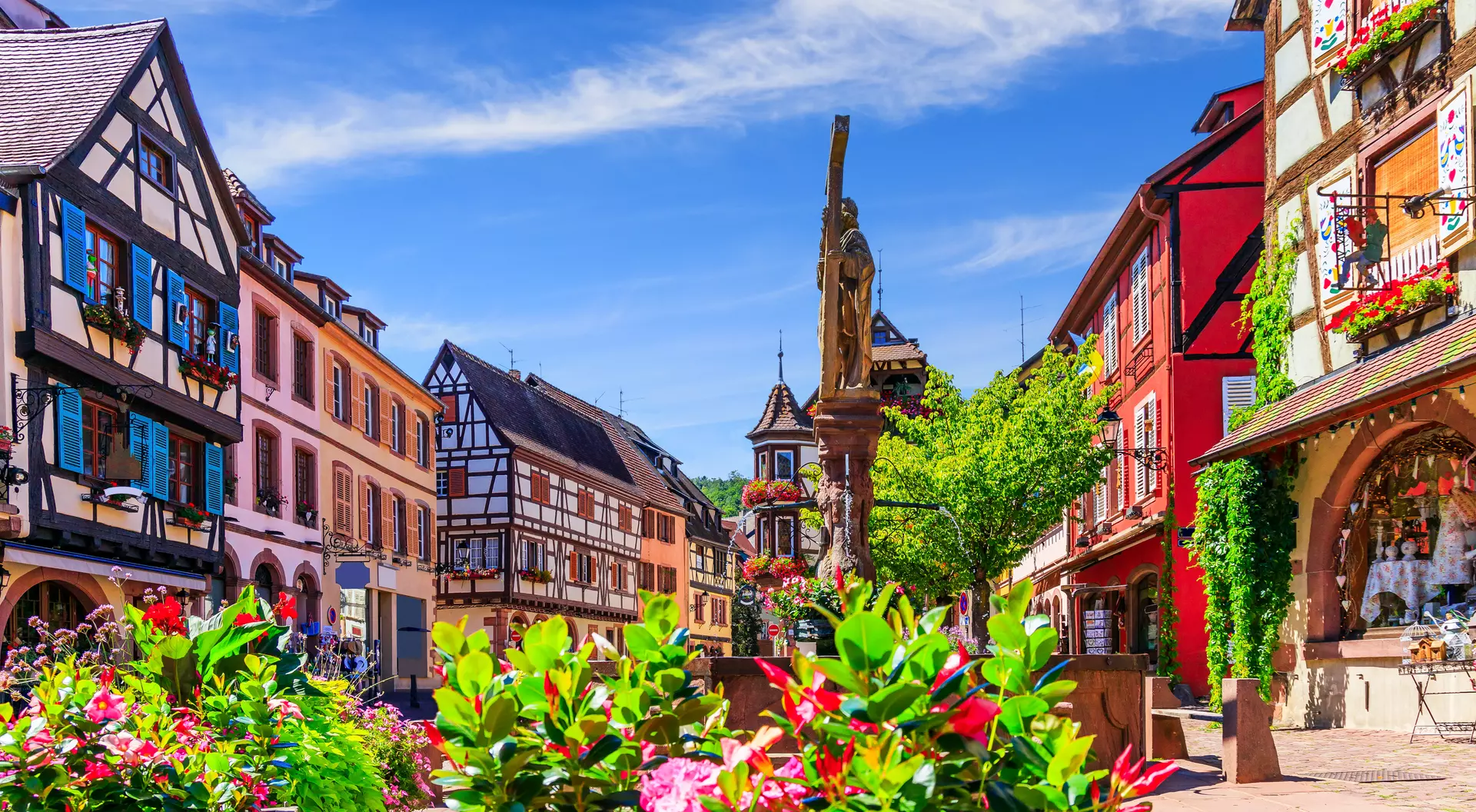 Picturesque street with traditional half timbered houses on the Alsace Wine Route.