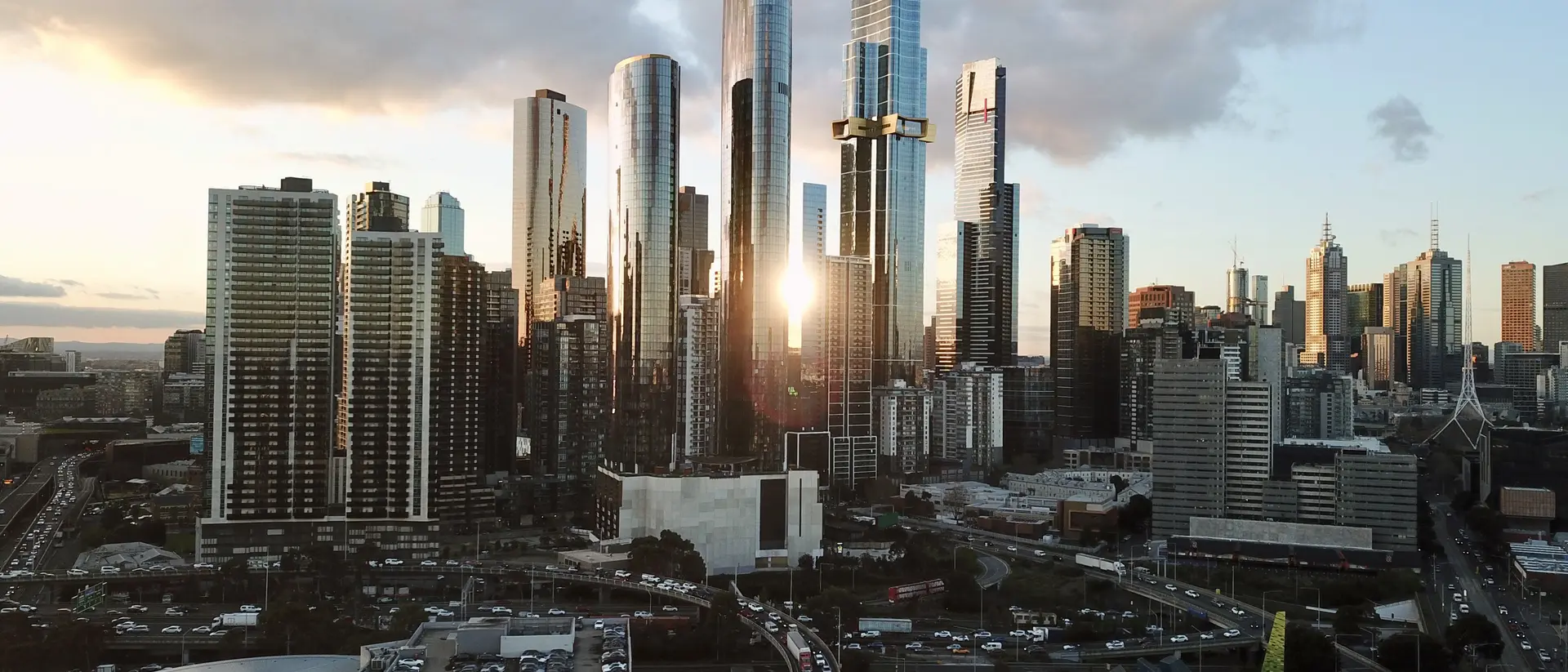 City skyscrapers with the sun setting behind