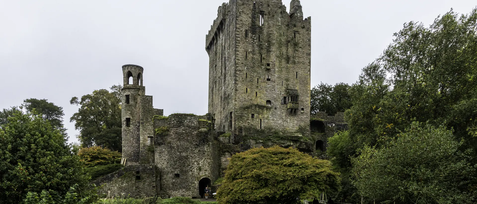 Blarney Castle was built by the MacCarthy of Muskerry dynasty and dates from 1446. Situated 8km from Cork City, this historic castle is most famous for its stone, which has the traditional power of conferring eloquence on all who kiss it. The stone is set in the wall below the battlements, and to kiss it one has to lean backwards (grasping an iron railing) from the parapet walk.