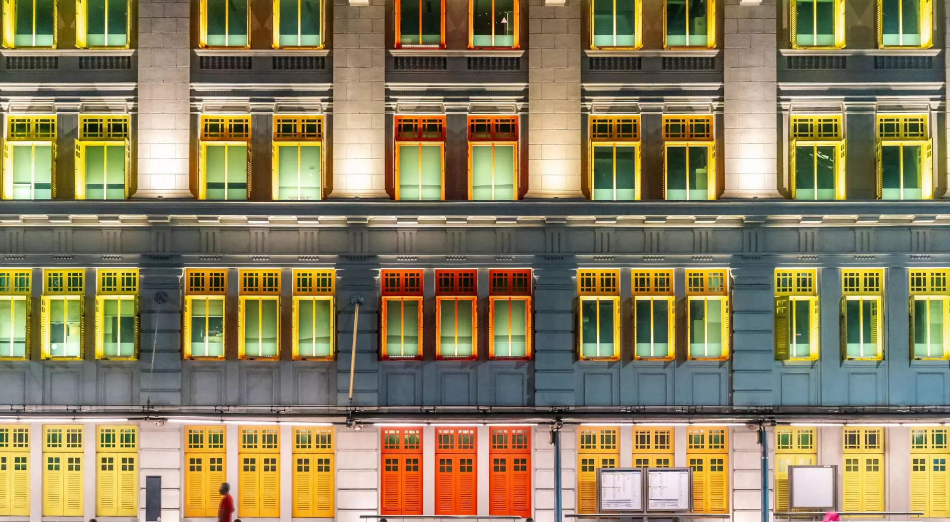 The Old Hill Street Police Station at night, building with colourful windows