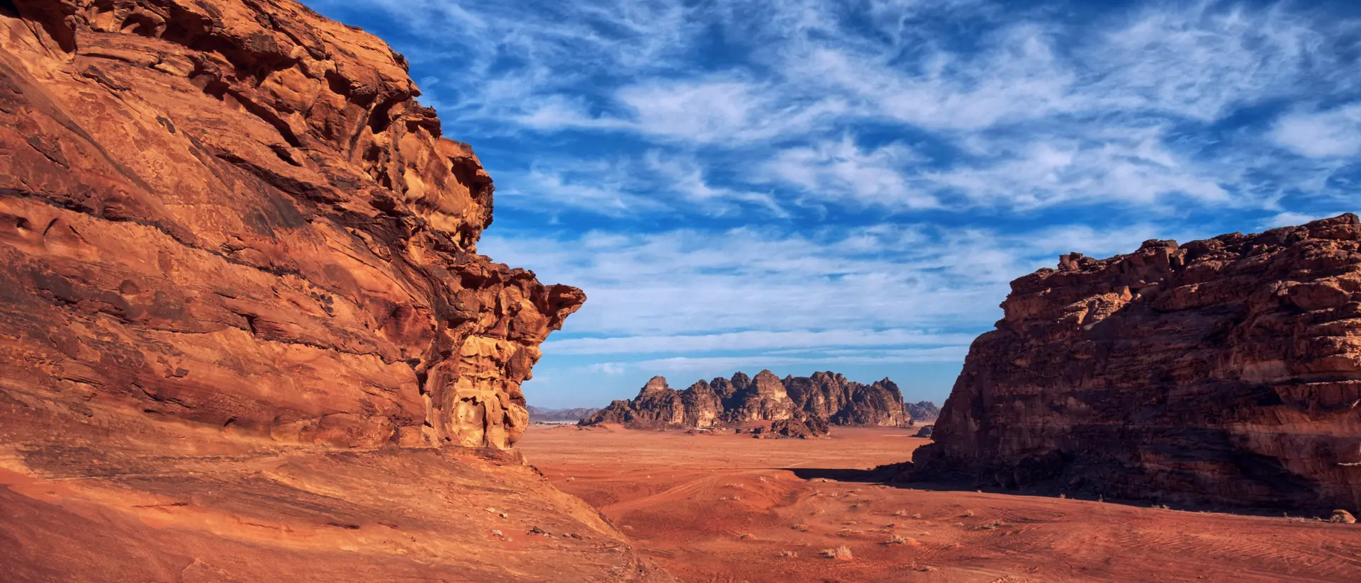Wadi Rum, known also as the Valley of the Moon , is a valley cut into the sandstone and granite rock
