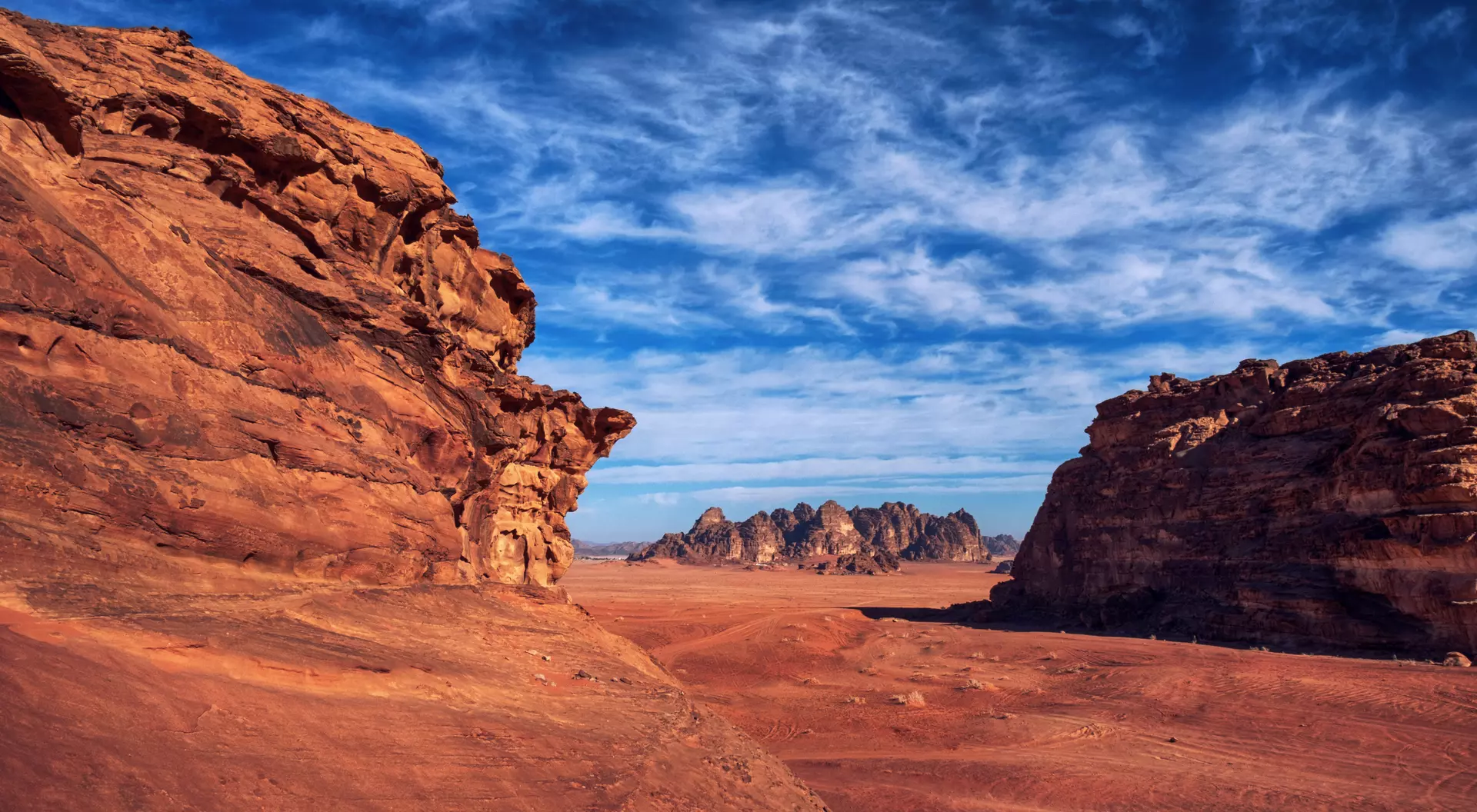 Wadi Rum, known also as the Valley of the Moon , is a valley cut into the sandstone and granite rock