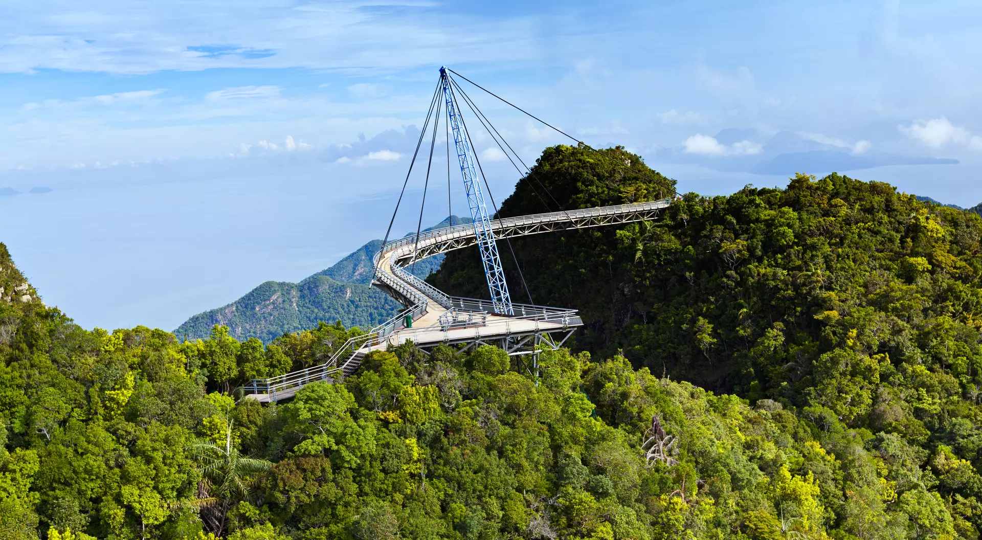 Amazing cable bridge over the tropical rainforest island landscape.