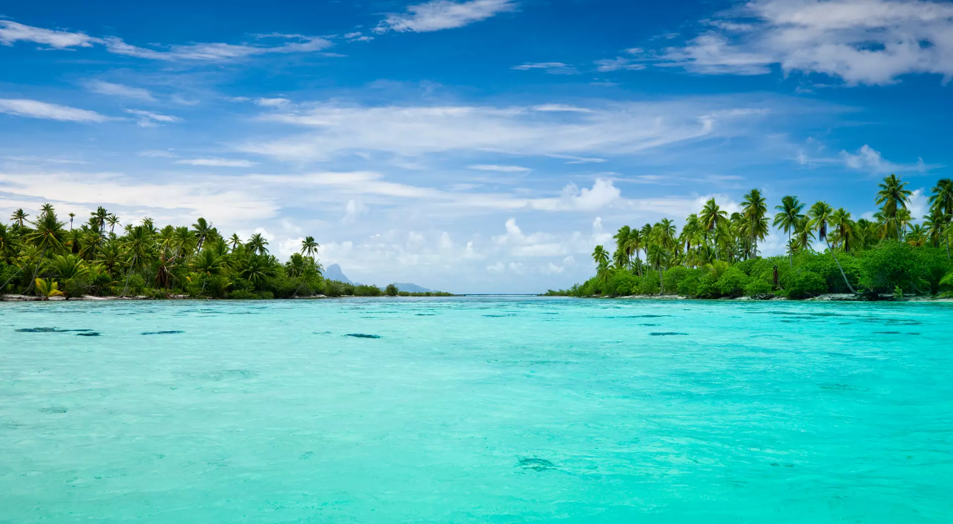 View over beautiful turquoise lagoon with small and lonesome islands.