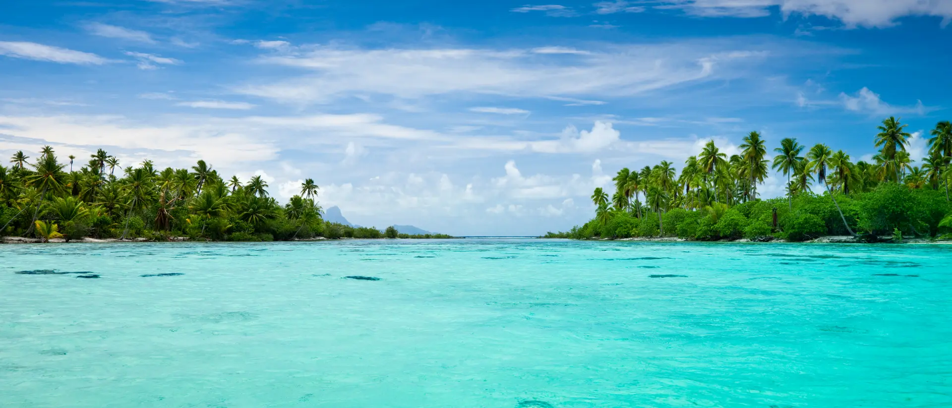 View over beautiful turquoise lagoon with small and lonesome islands.