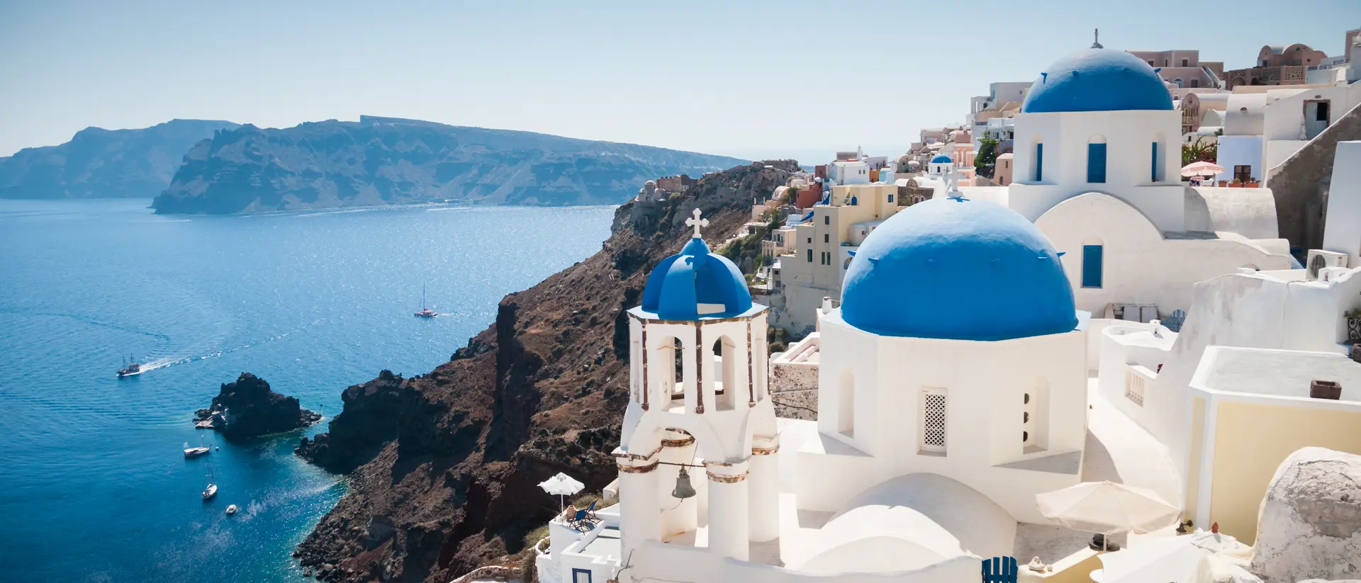 Blue domed church along caldera edge in Oia.