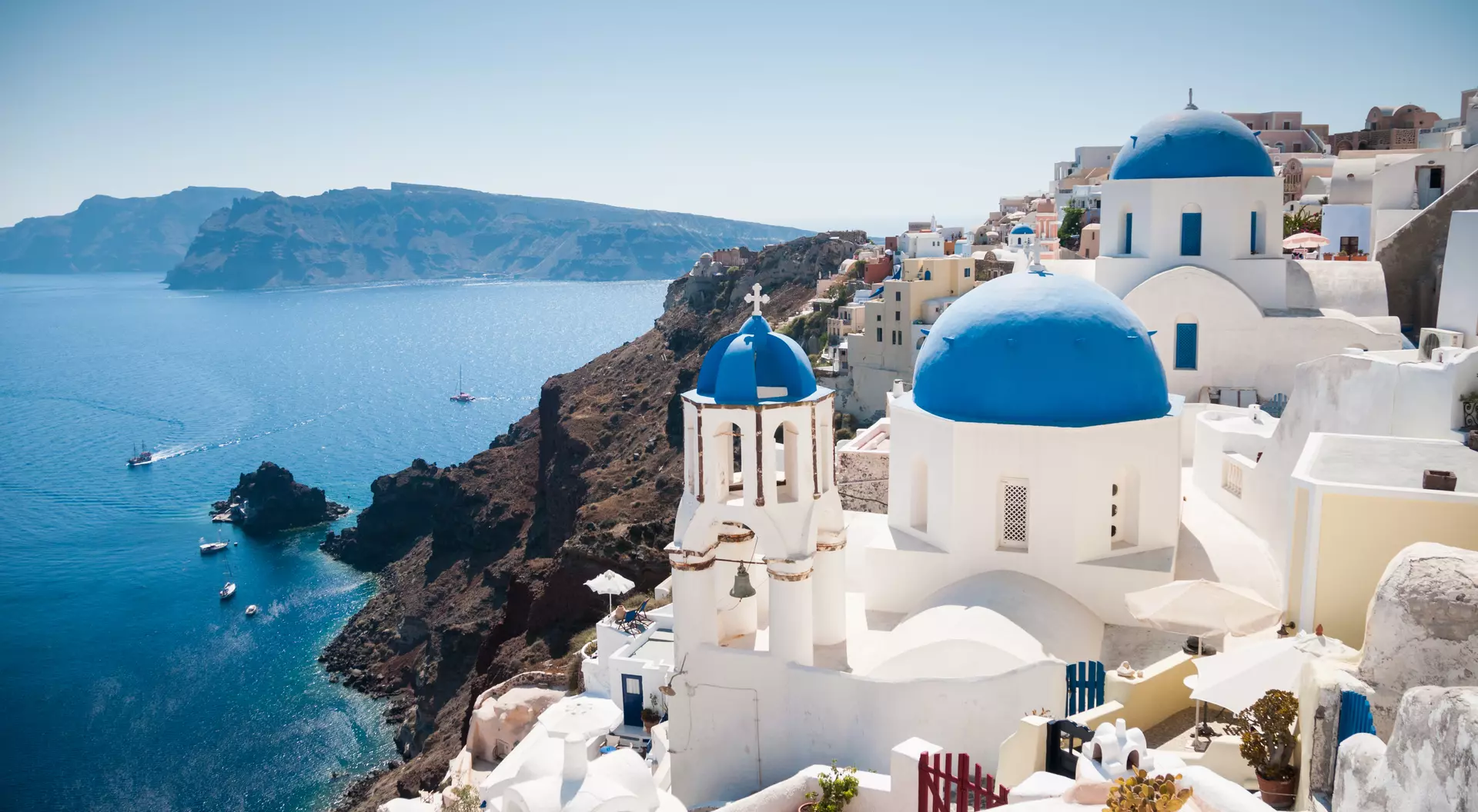 Blue domed church along caldera edge in Oia.