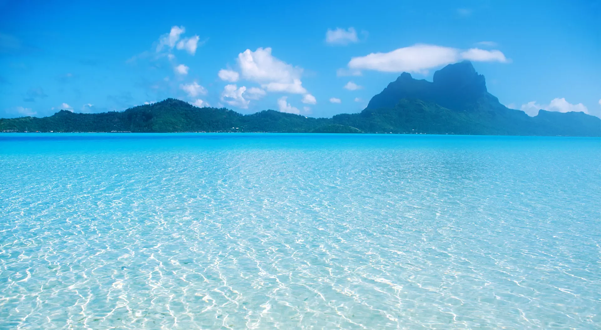 Clear and shallow blue waters in Bora Bora.