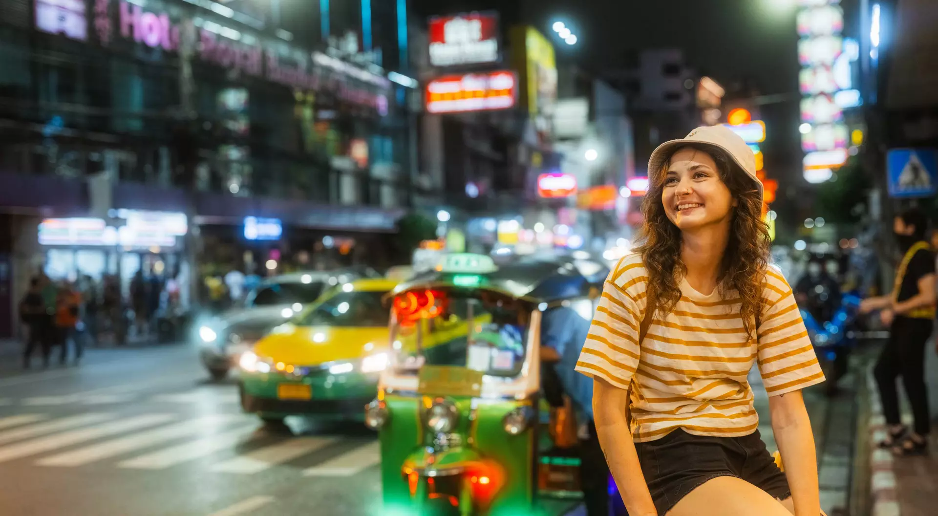 Woman exploring Chinatown in Bangkok at night