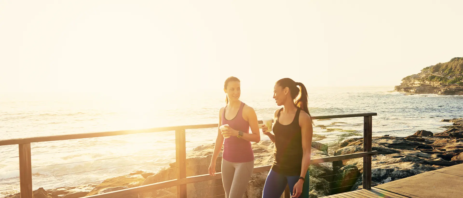 Women walking along the coast