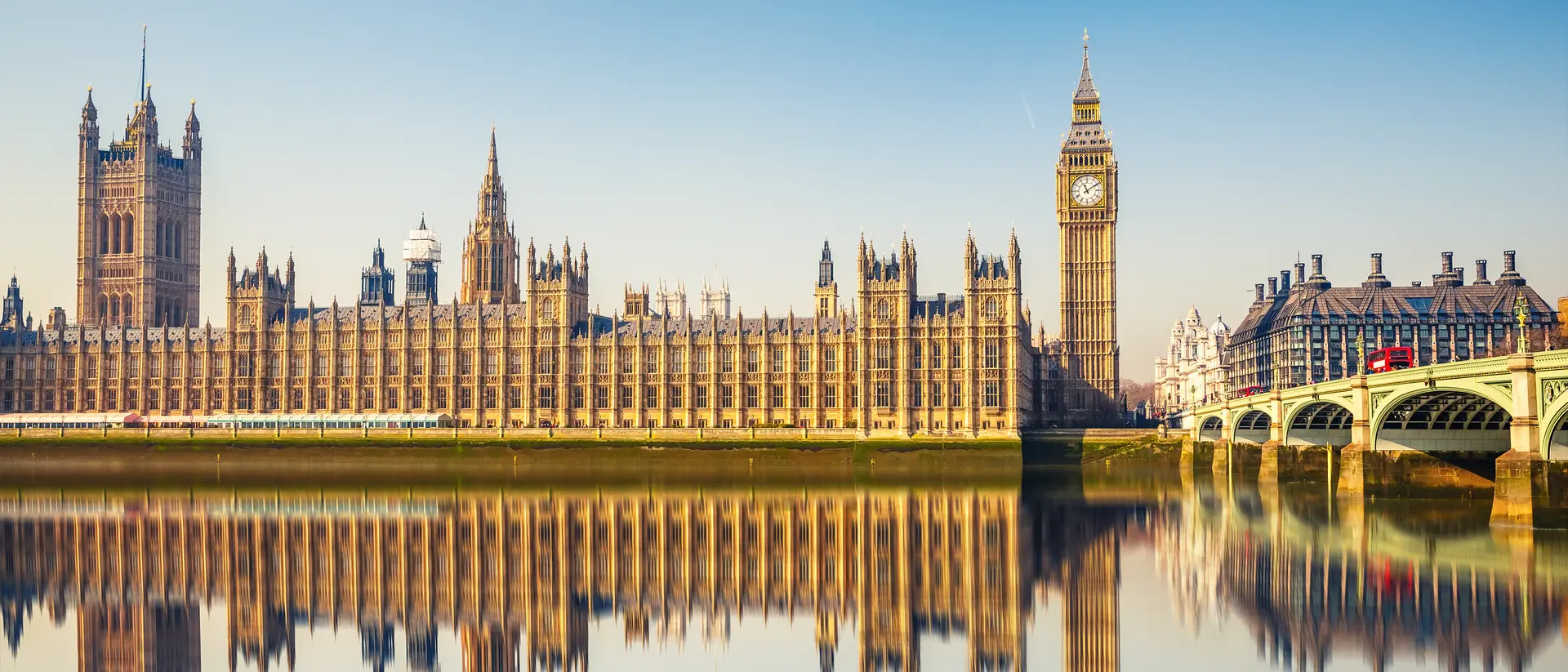 Big Ben and Houses of parliament at calm sunny morning.
