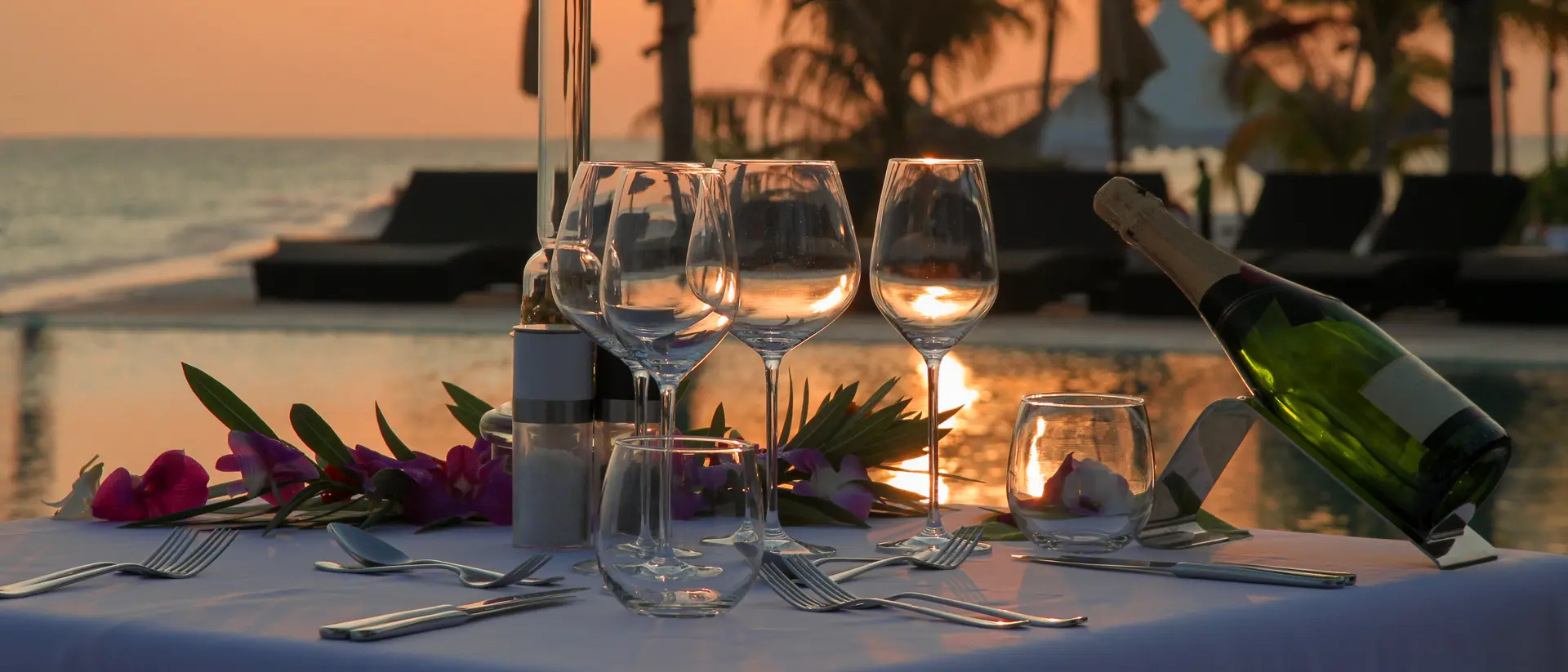 Beach Dinner by the Infinity Pool in Sunset Scenery.