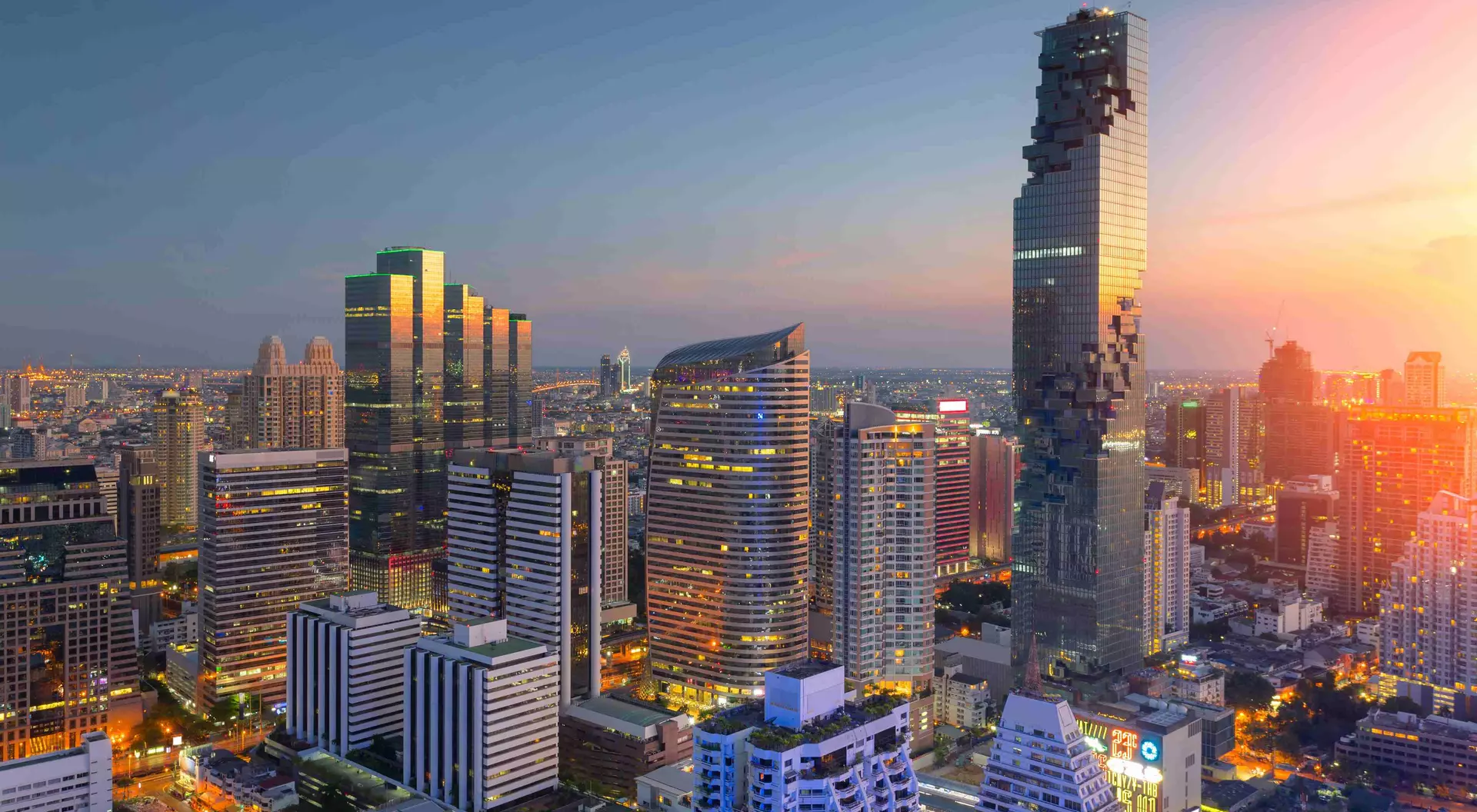Aerial view of modern office buildings, condominium in Bangkok city downtown,Mahanakorn tower with sunset sky , Bangkok , Thailand