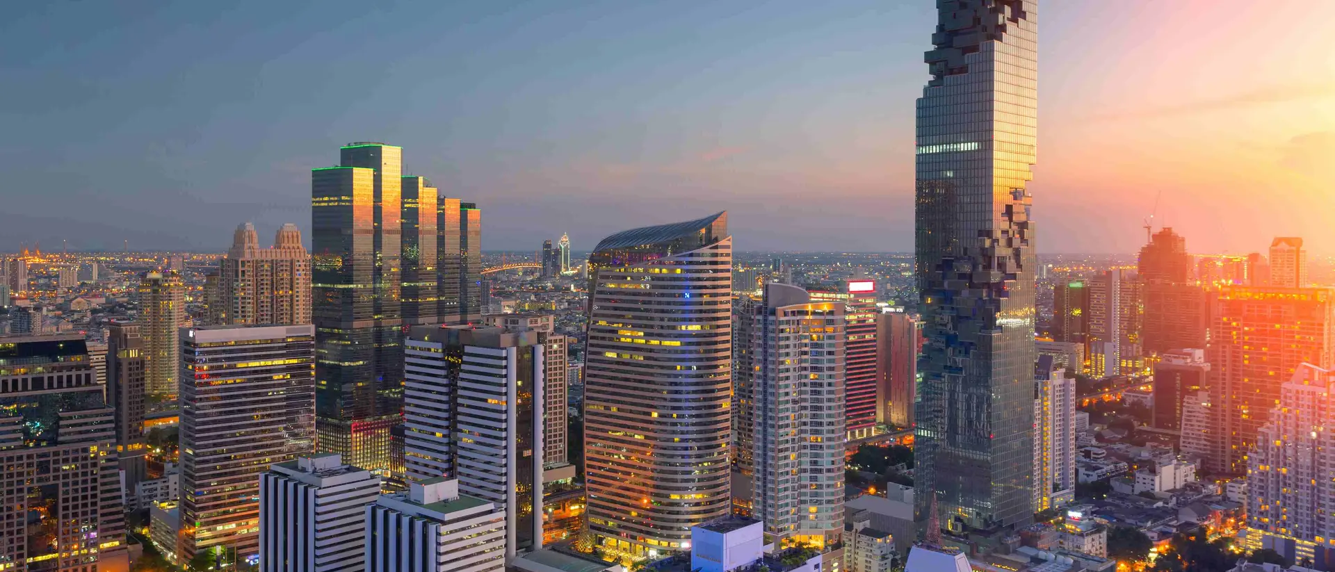 Aerial view of modern office buildings, condominium in Bangkok city downtown,Mahanakorn tower with sunset sky , Bangkok , Thailand