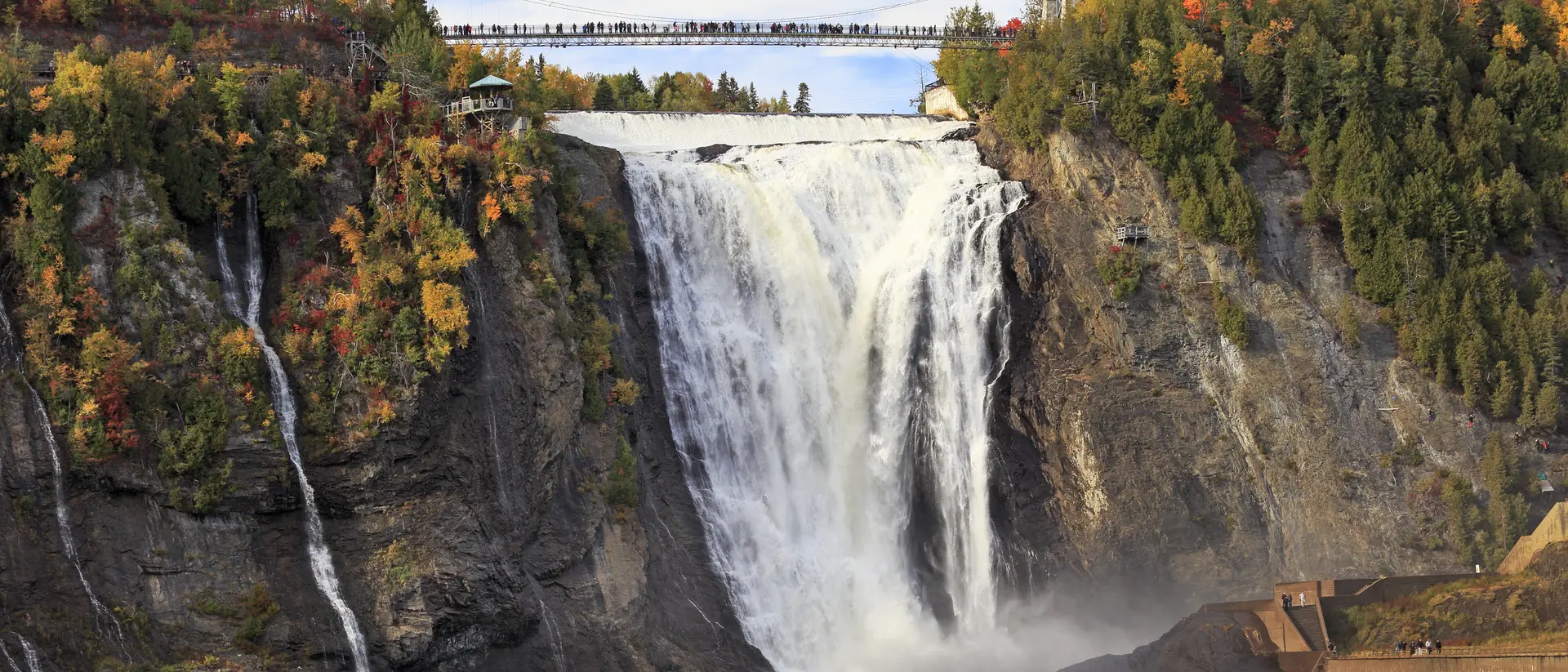 Montmorency Falls and Bridge in autumn with colorful trees