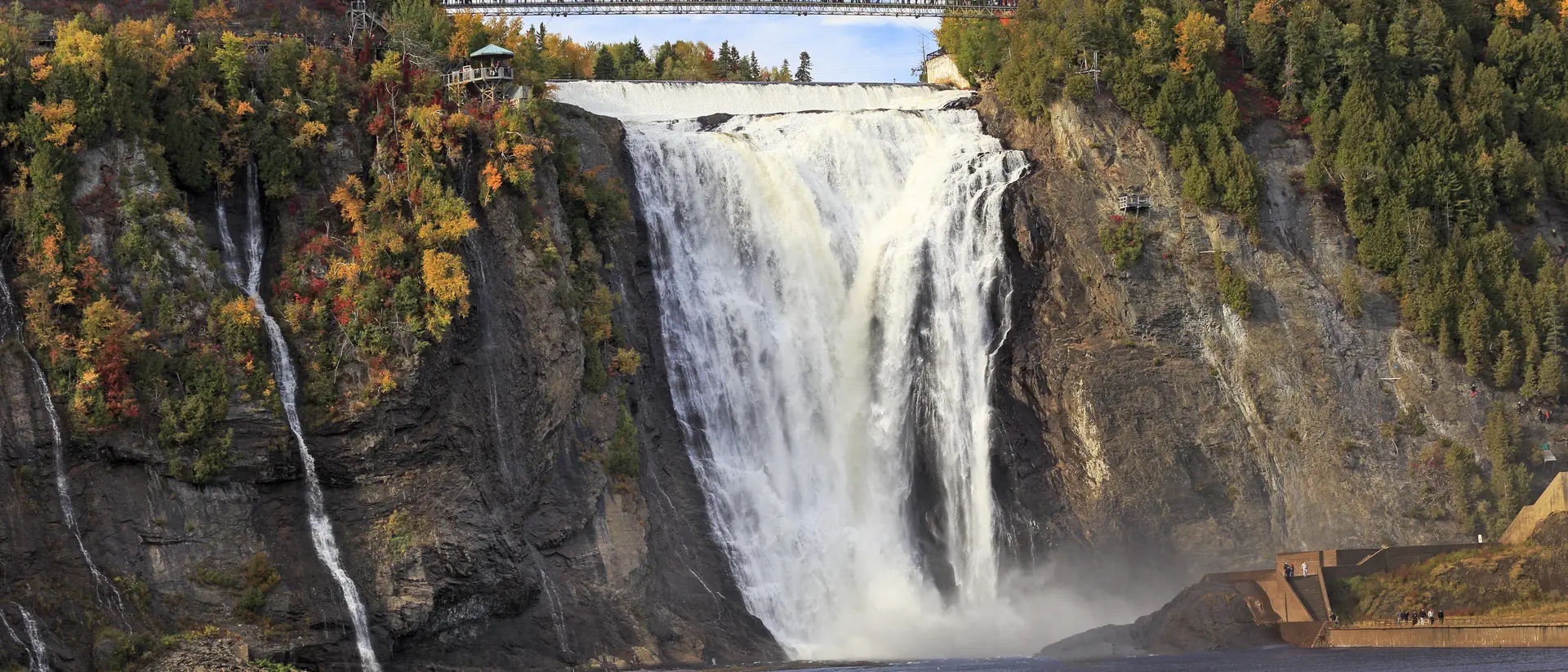 Montmorency Falls and Bridge in autumn with colorful trees