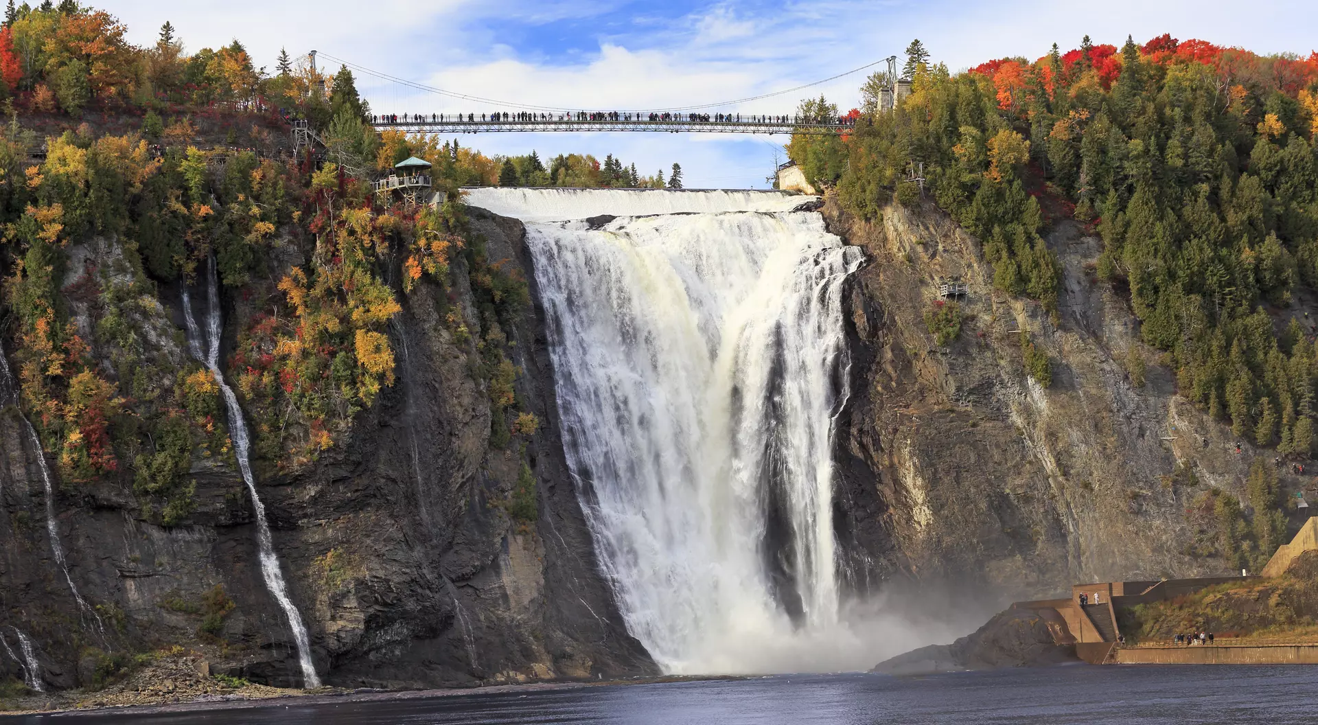 Montmorency Falls and Bridge in autumn with colorful trees