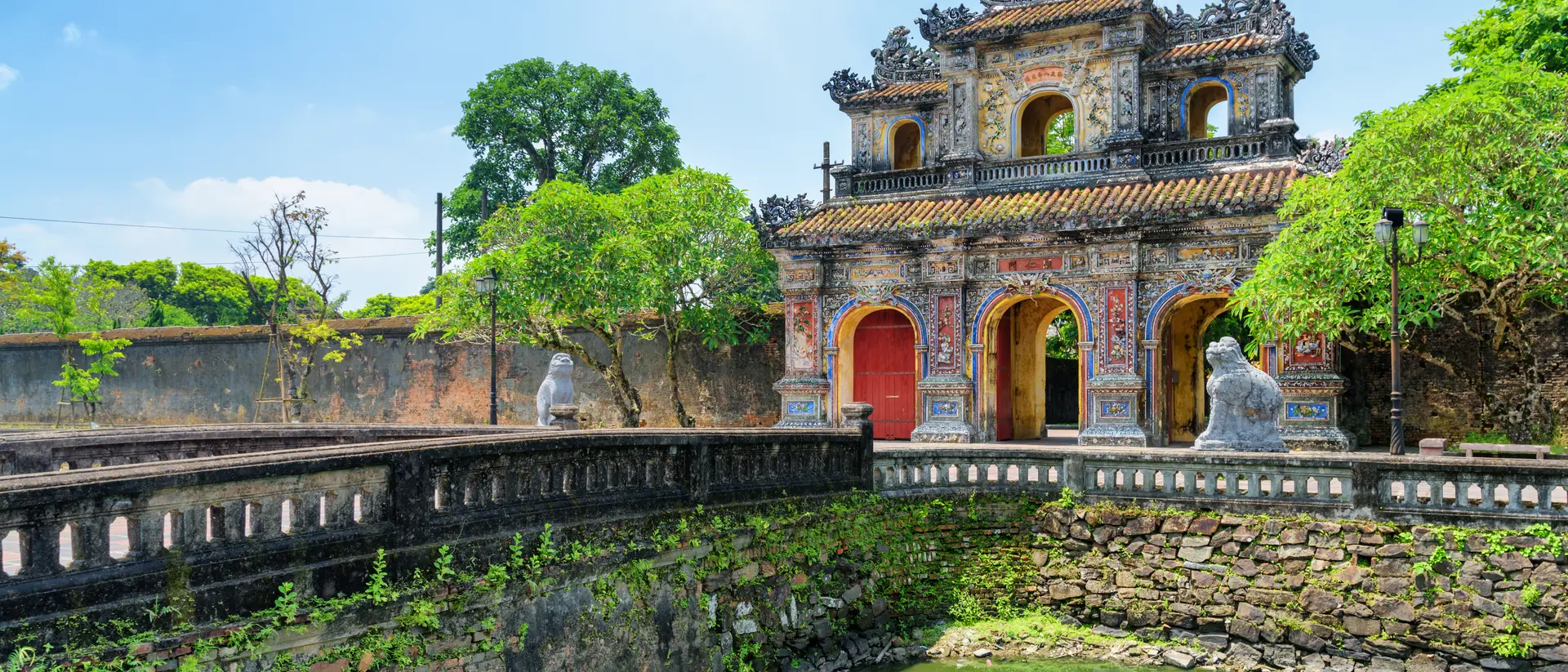 Wonderful view of the East Gate (Hien Nhon Gate) to the Citadel and a moat surrounding the Imperial City with the Purple Forbidden City. 