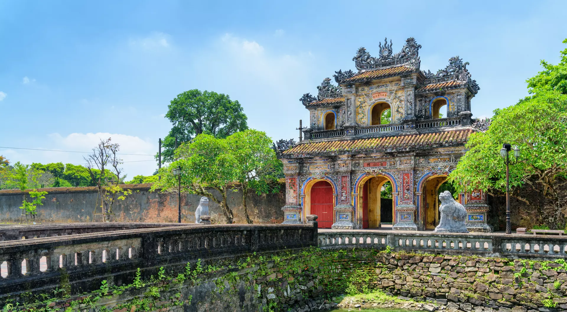 Wonderful view of the East Gate (Hien Nhon Gate) to the Citadel and a moat surrounding the Imperial City with the Purple Forbidden City. 