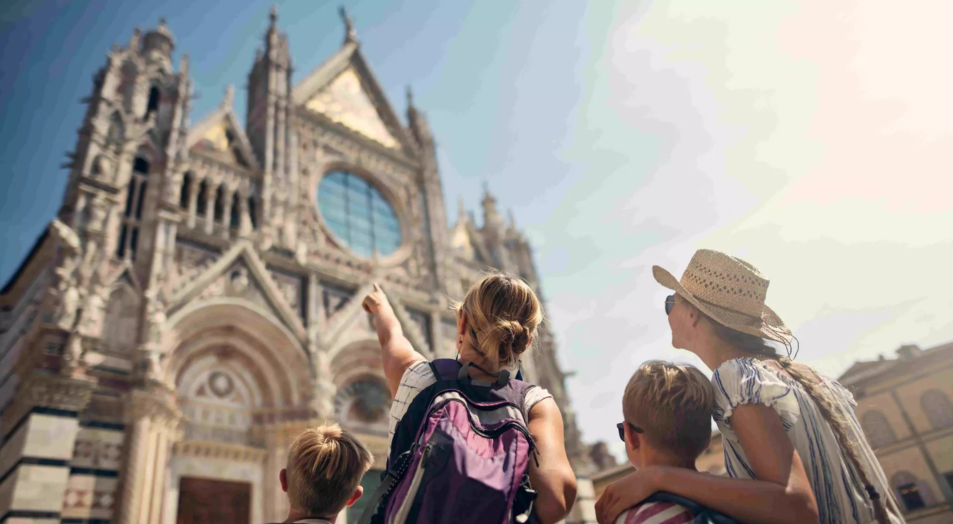 family looking at a cathedral in Italy